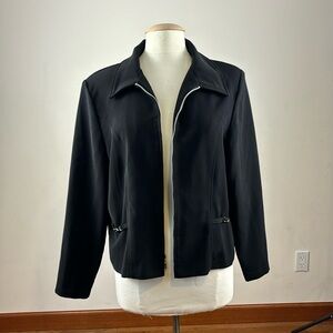 Black zip up Briggs New York jacket with silver accents. Women’s size Large